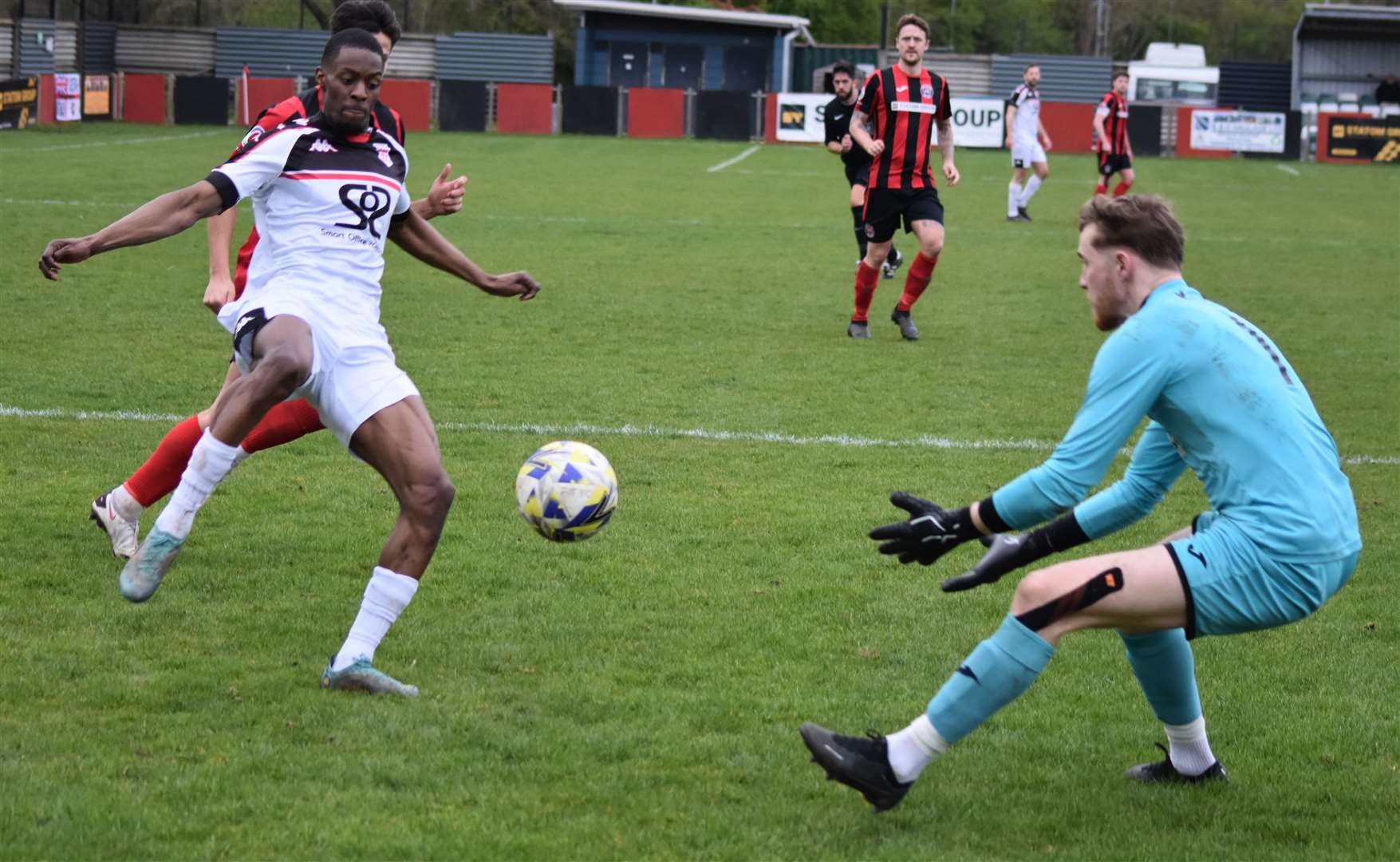 New Faversham signing Darnelle Bailey-King is foiled by Erith Town keeper Mackenzie Foley. Picture: Alan Coomes