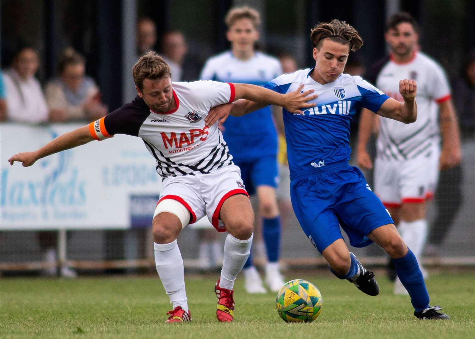 Deal midfielder Macauley Murray in action against Gillingham's Ben White. Picture: Paul Willmott