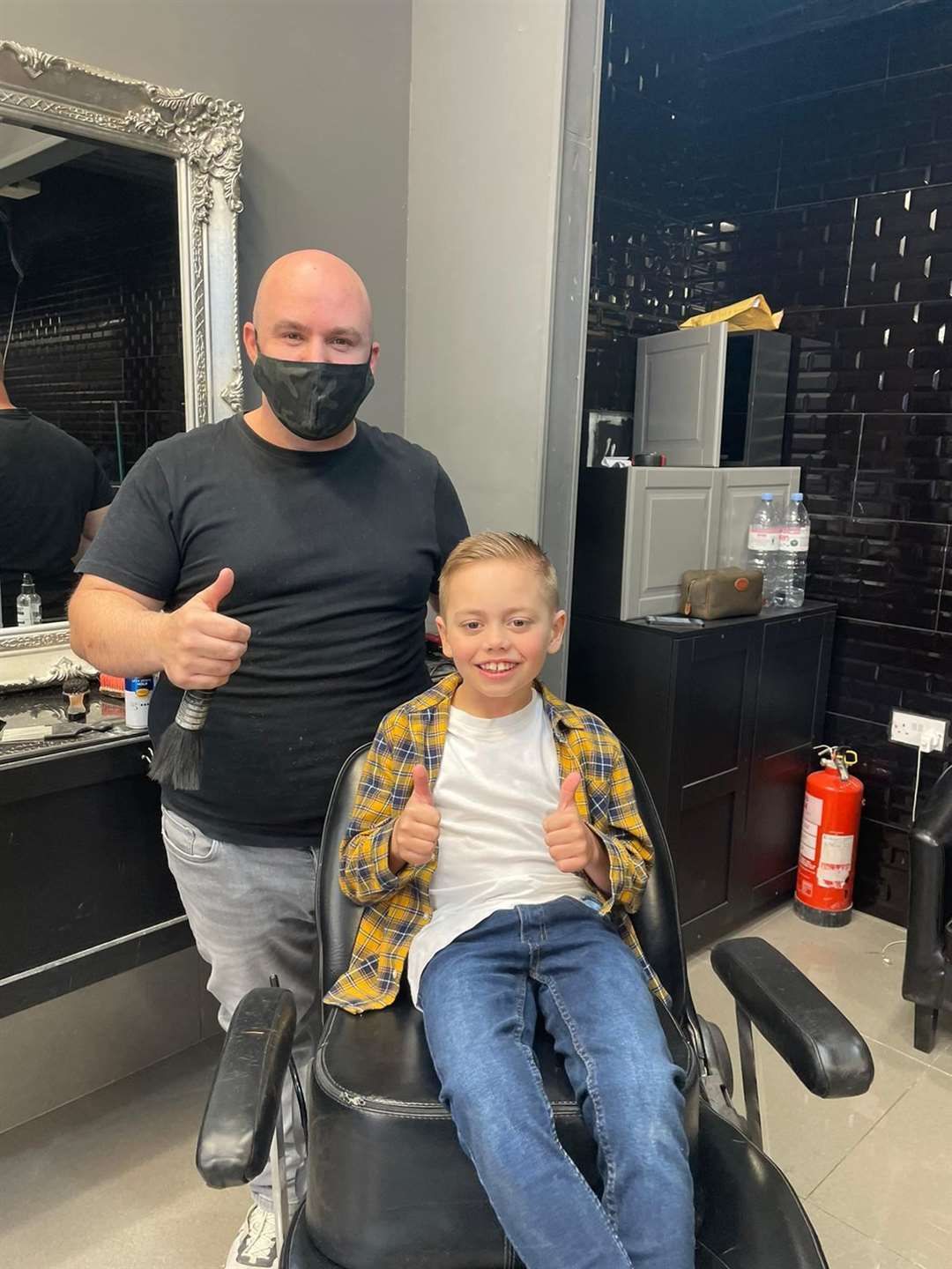 Mem, from Memz Barbers in Dartford, and Harry, after the chop. Picture: Charlotte Bilsland