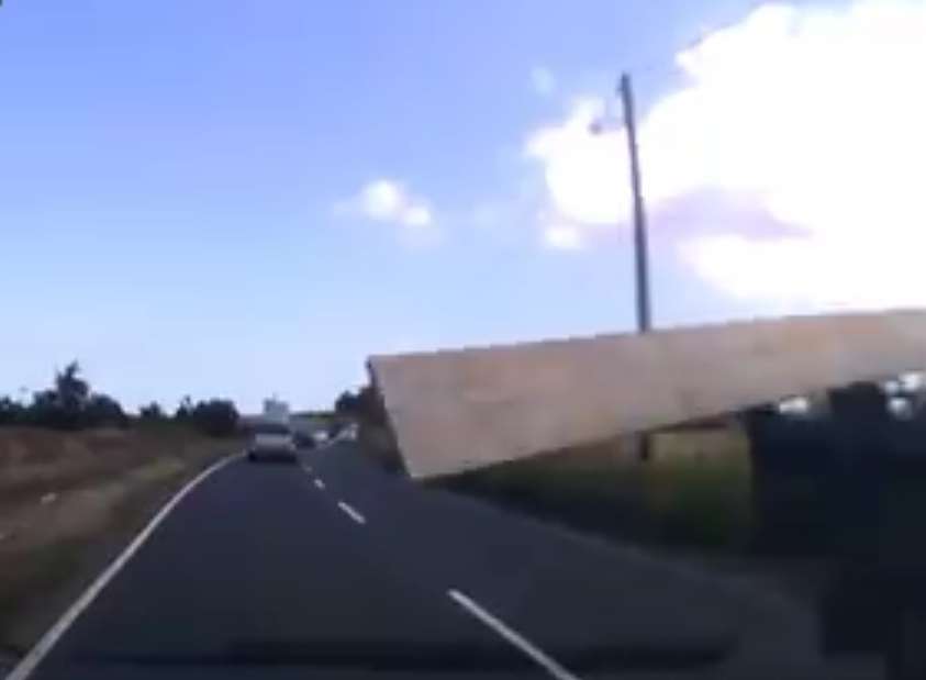 Stills from Darren Willett's dashcam show the plank flying towards the windscreen