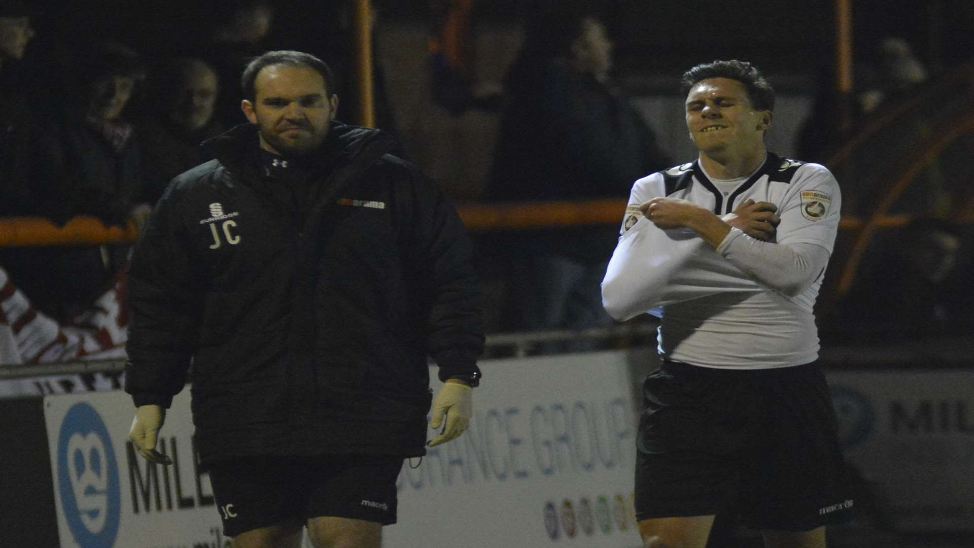 Joe Howe leaves the field at Braintree with Fleet physio Jamie Crosswell Picture: Paul Jarvis