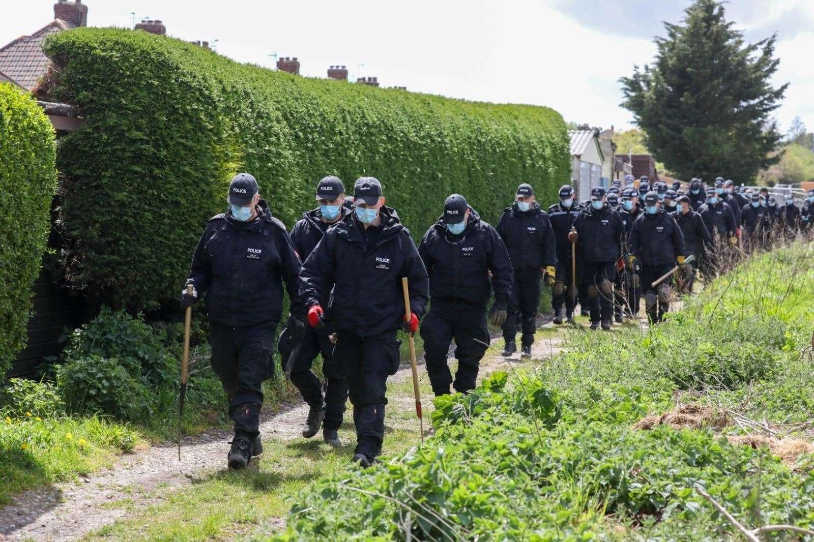 Police officers searching in Aylesham as part of the Julia James murder investigation. Picture: UKNiP