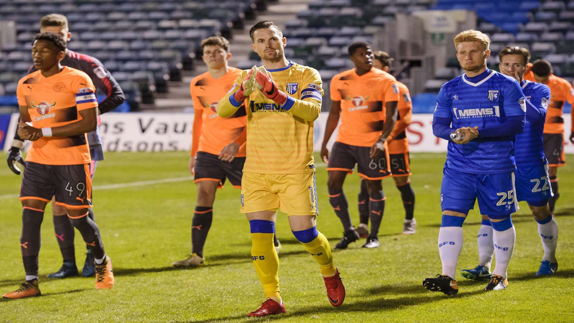 Skipper-for-the-night Stuart Nelson leads Gills out to face Reading under-21s Picture: Andy Payton