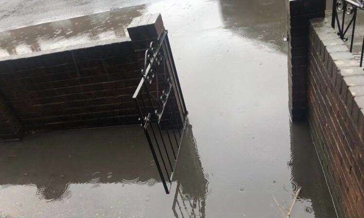 Outside the family's home during last week's rain. Pictures: Rachel Harman