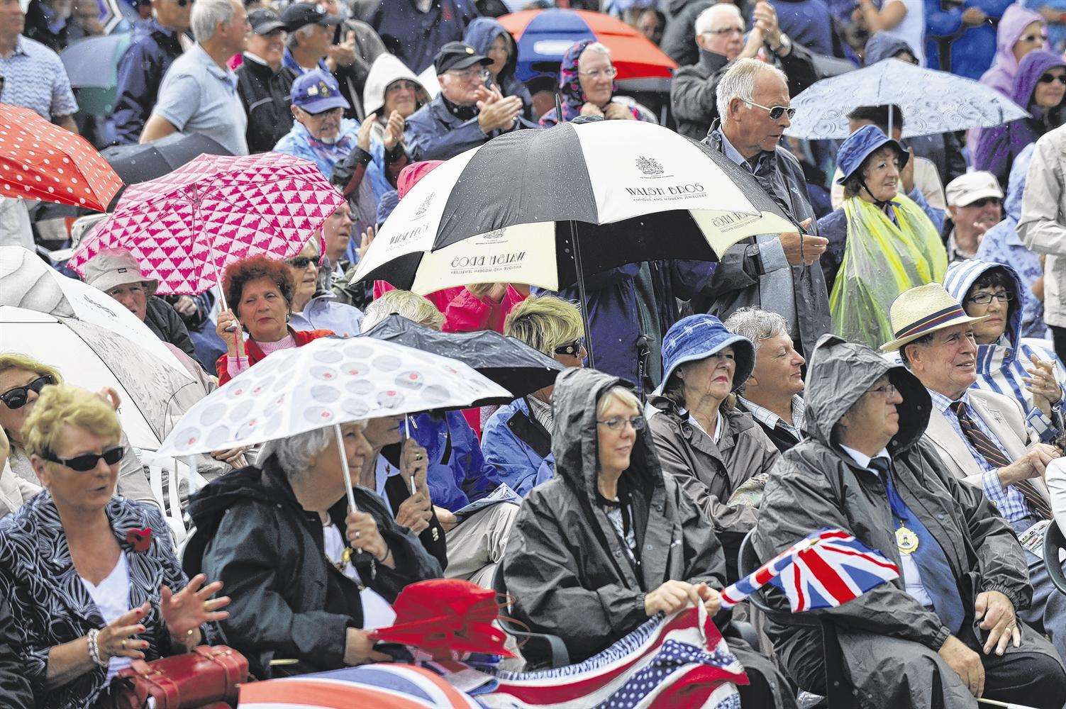 Umbrellas and rain macs came out when the rain started