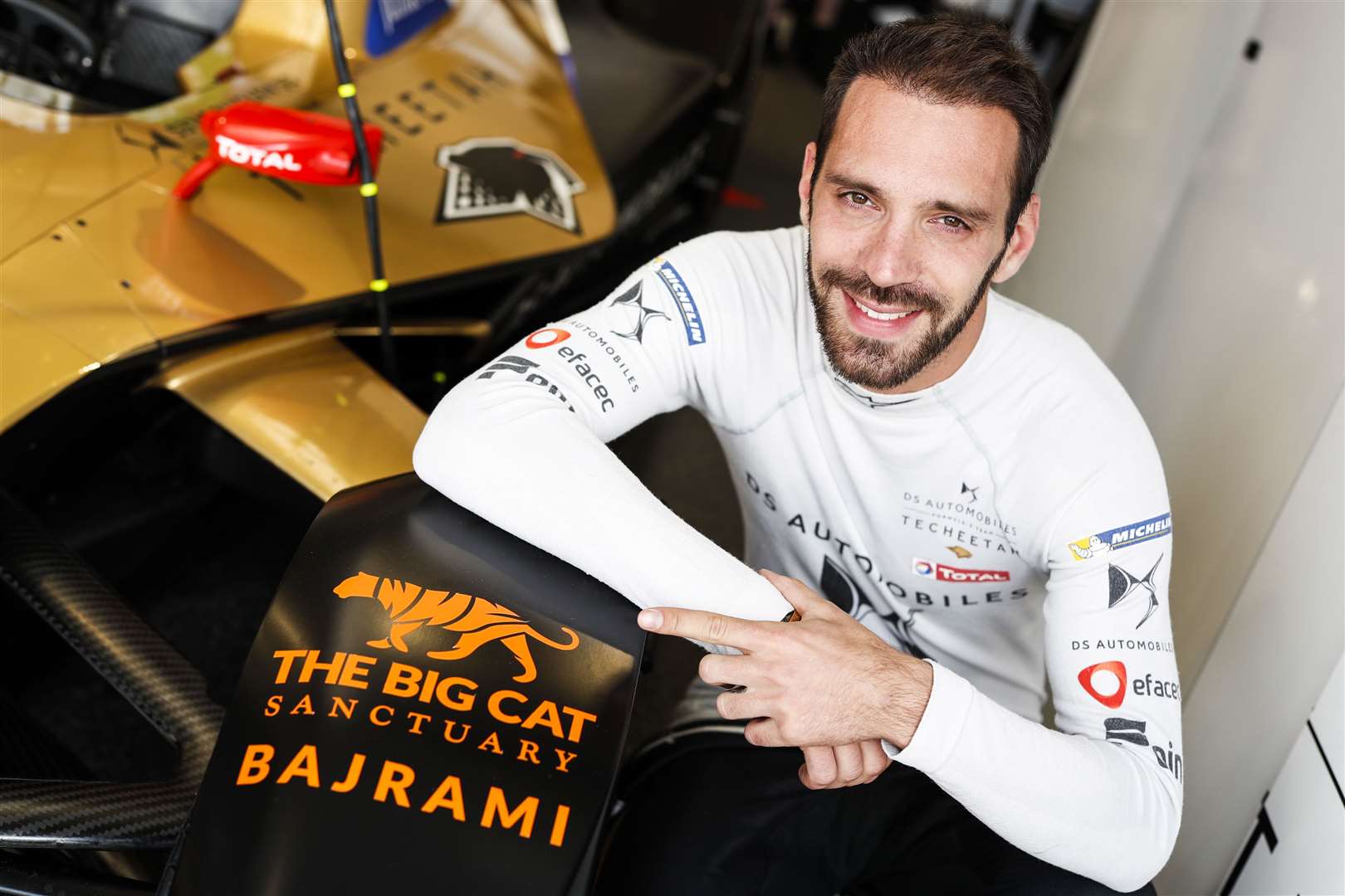 Jean-Eric Vergne poses with the Big Cat Sanctuary logo on his Formula E car