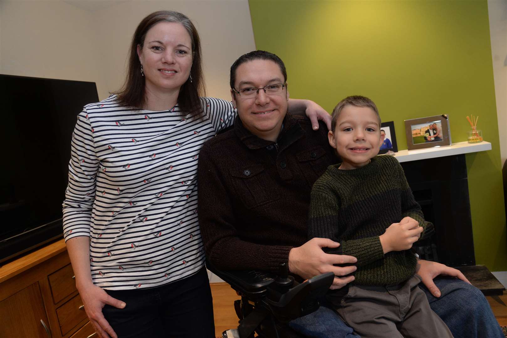 Andrew, pictured with wife Joanne and son Thomas.