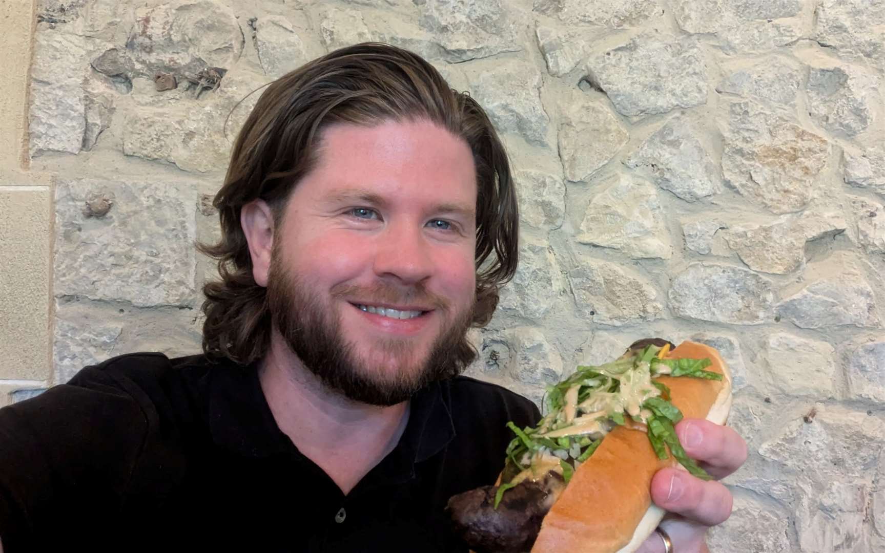 Rhys Griffiths gets set to tuck into his ‘haute dog’ at The Naughty Dog at Lympne Castle