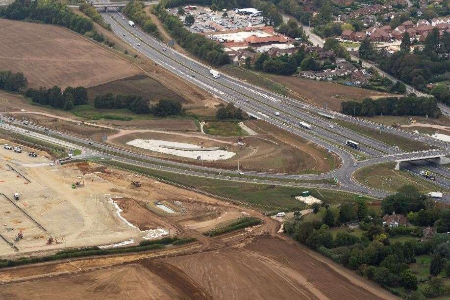 All vehicles accessing the lorry park will have to use Junction 10a and bosses say drivers will be fined if caught using other routes. This photo shows just how close the site is to the £104m junction, which opened to traffic in October last year. Junction 10a has been built just 700 metres south east of the original Junction 10. The former coastbound on-slip at Junction 10 and the London-bound off-slip have now been landscaped, as can be seen in the top left. Picture: Ady Kerry / Ashford Borough Council