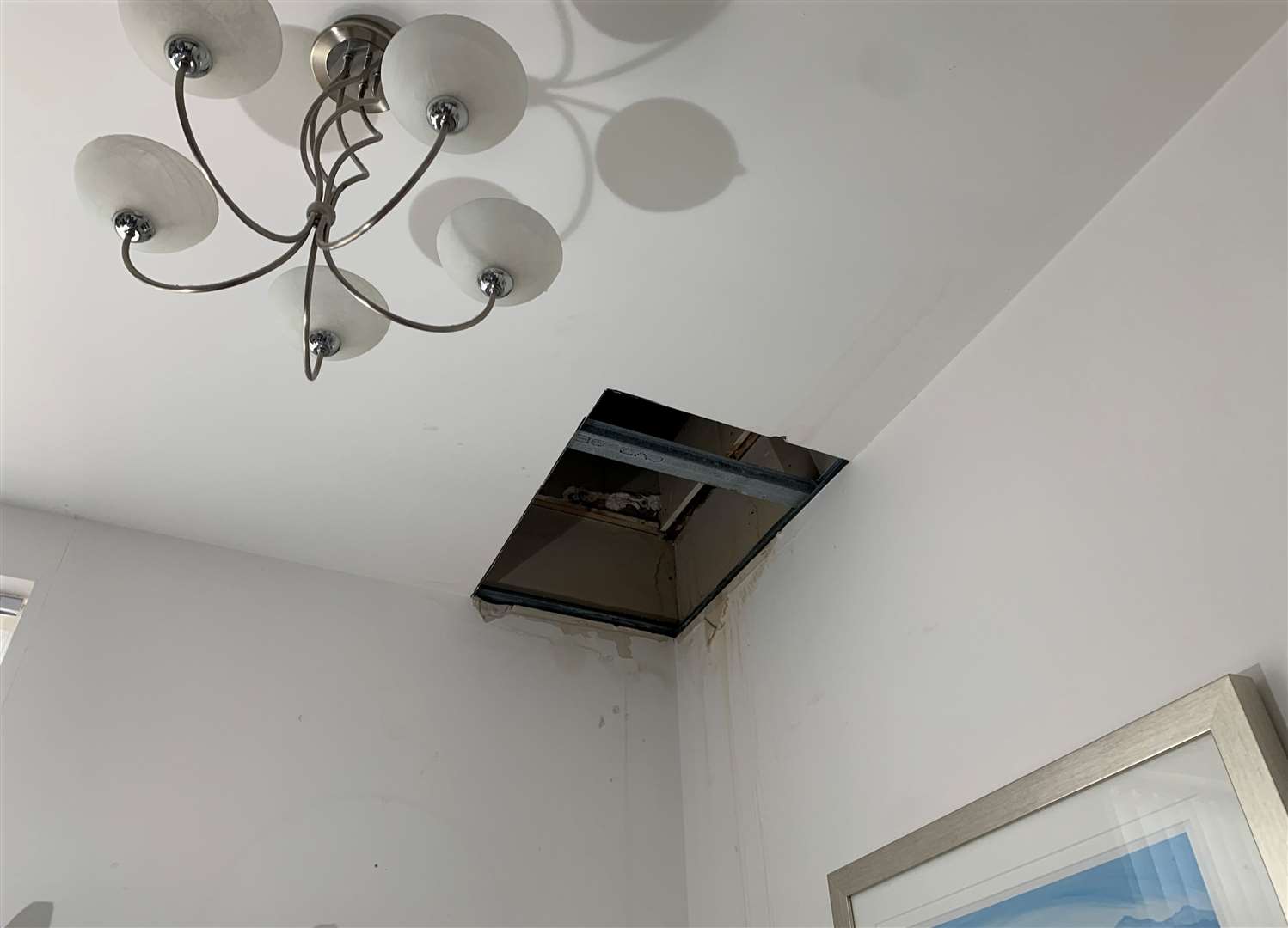 A hole was made in the ceiling of Steve Fort's Ramsgate flat to investigate the source of the leak