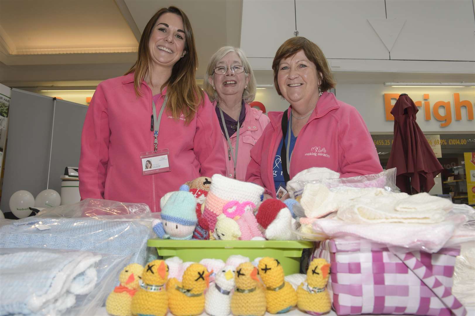 Rebecca Johnson, Carole Bowey, and Pat Bax from Making Miracles. Indian street food seller and character Andy Singh holds a fundraiser for charity Making Miracles, at his stall in the Thamesgate Shopping Centre, Gravesend. Picture: Andy Payton (1415303)