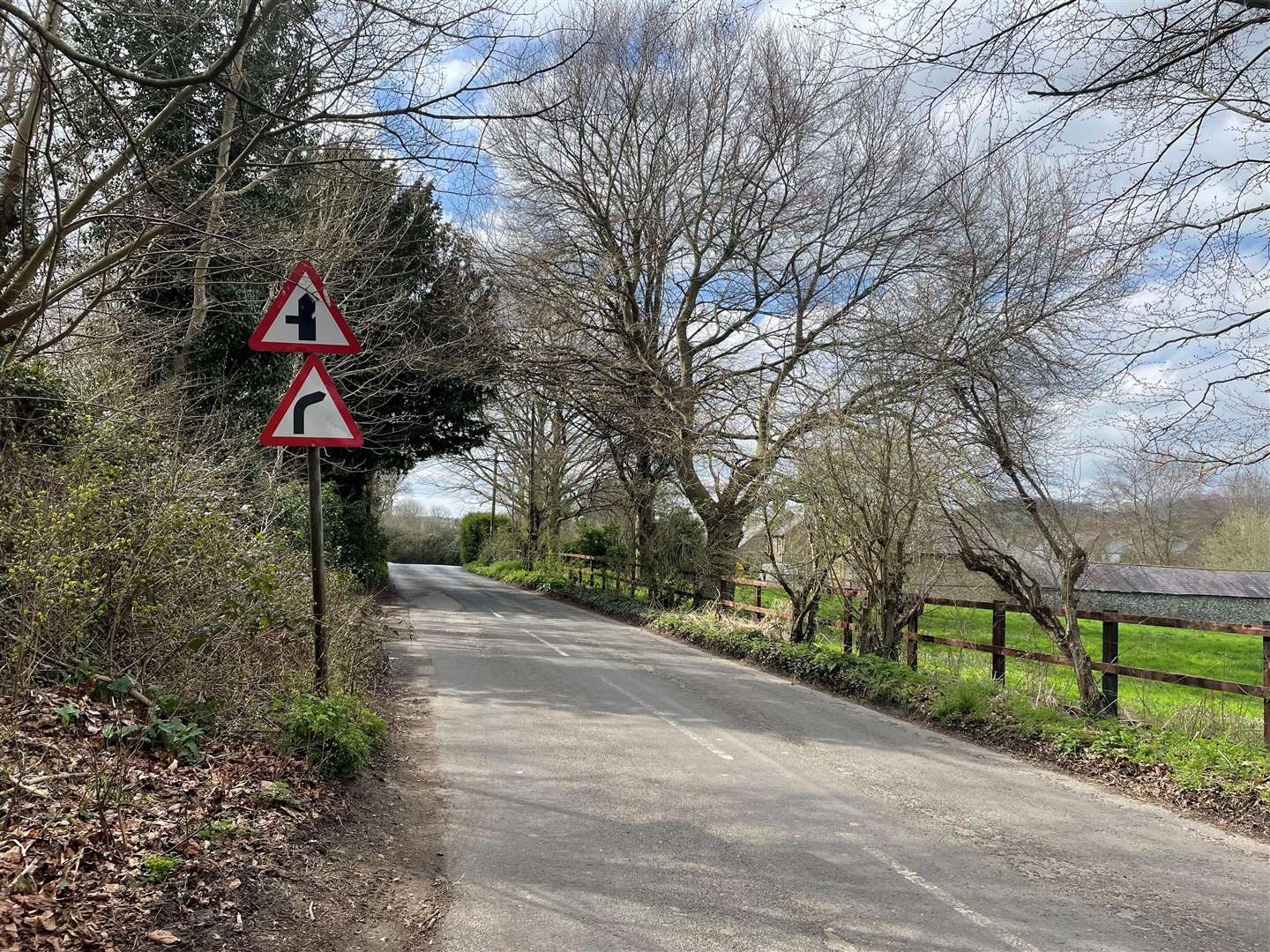 Residents say the signs contradict each other and confuse drivers. View looking down Horton Road towards the bend