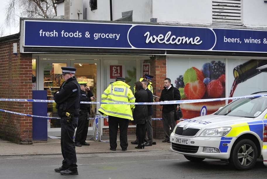 Police outside the Welcome store in Ash. Picture: Tony Flashman