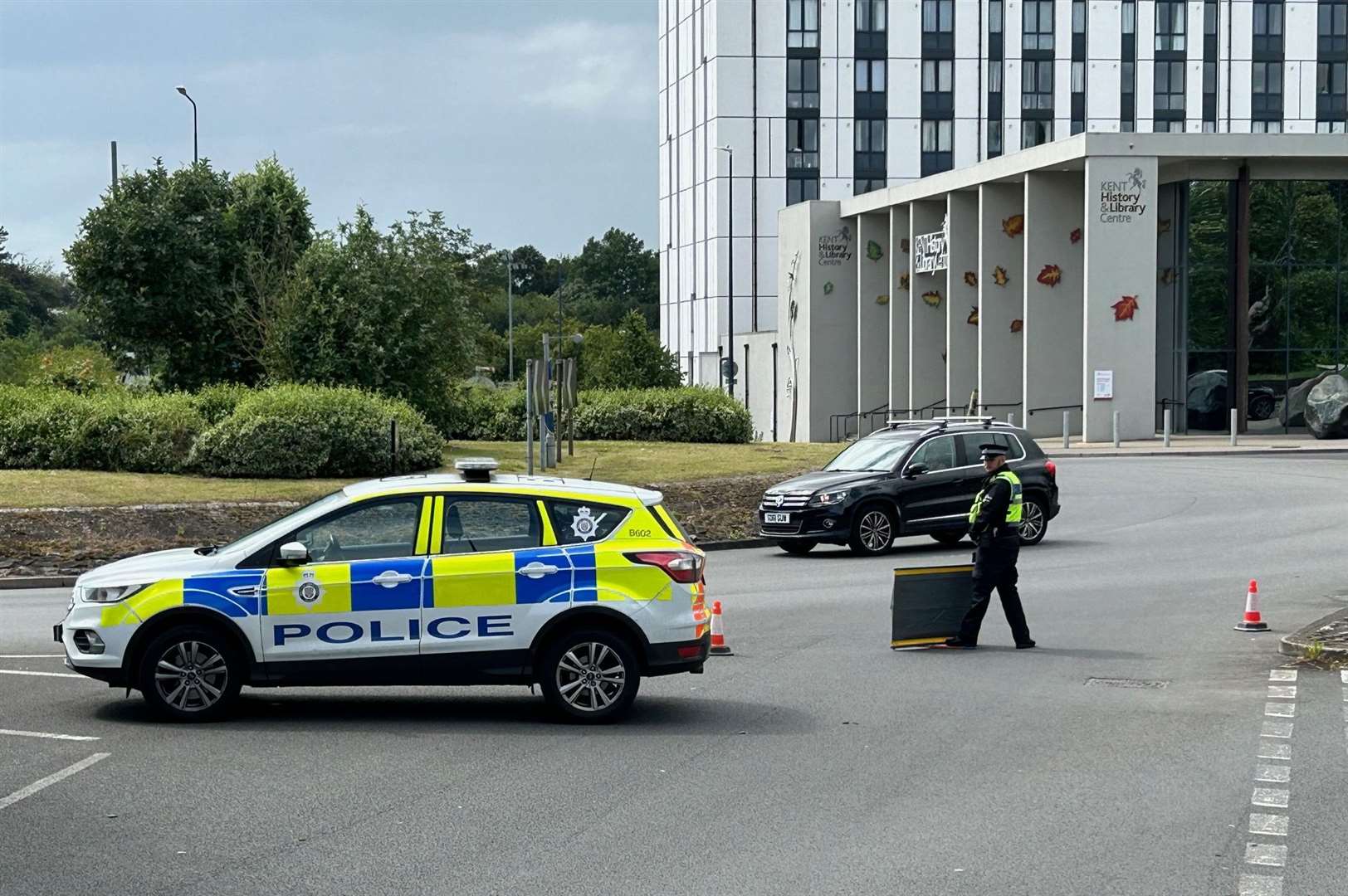 The car crashed through railings into a tree on the busy roundabout