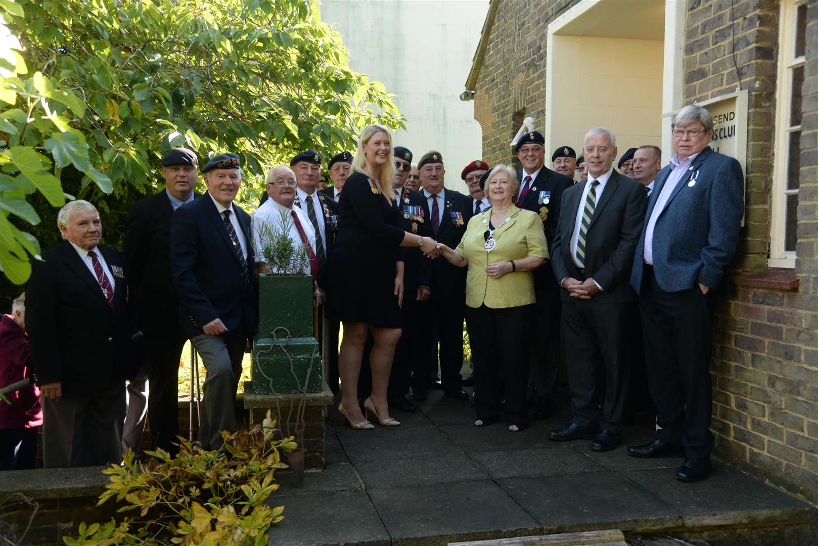 Charlotte Summer, Chairman of the Gravesend Veterans Social Club greets Deputy Mayor Cllr Lesley Boycott as they recreate the opening day photograph on Wednesday. Picture: Chris Davey... (4730856)