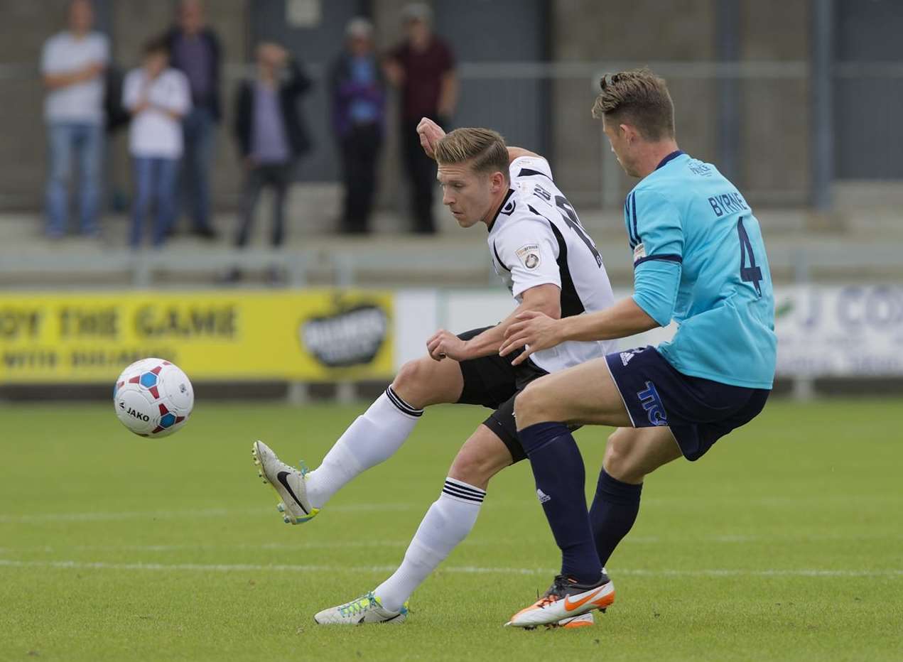 Andy Pugh, who scored the winning goal, plays the ball past Telford's Neil Byrne Picture: Andy Payton