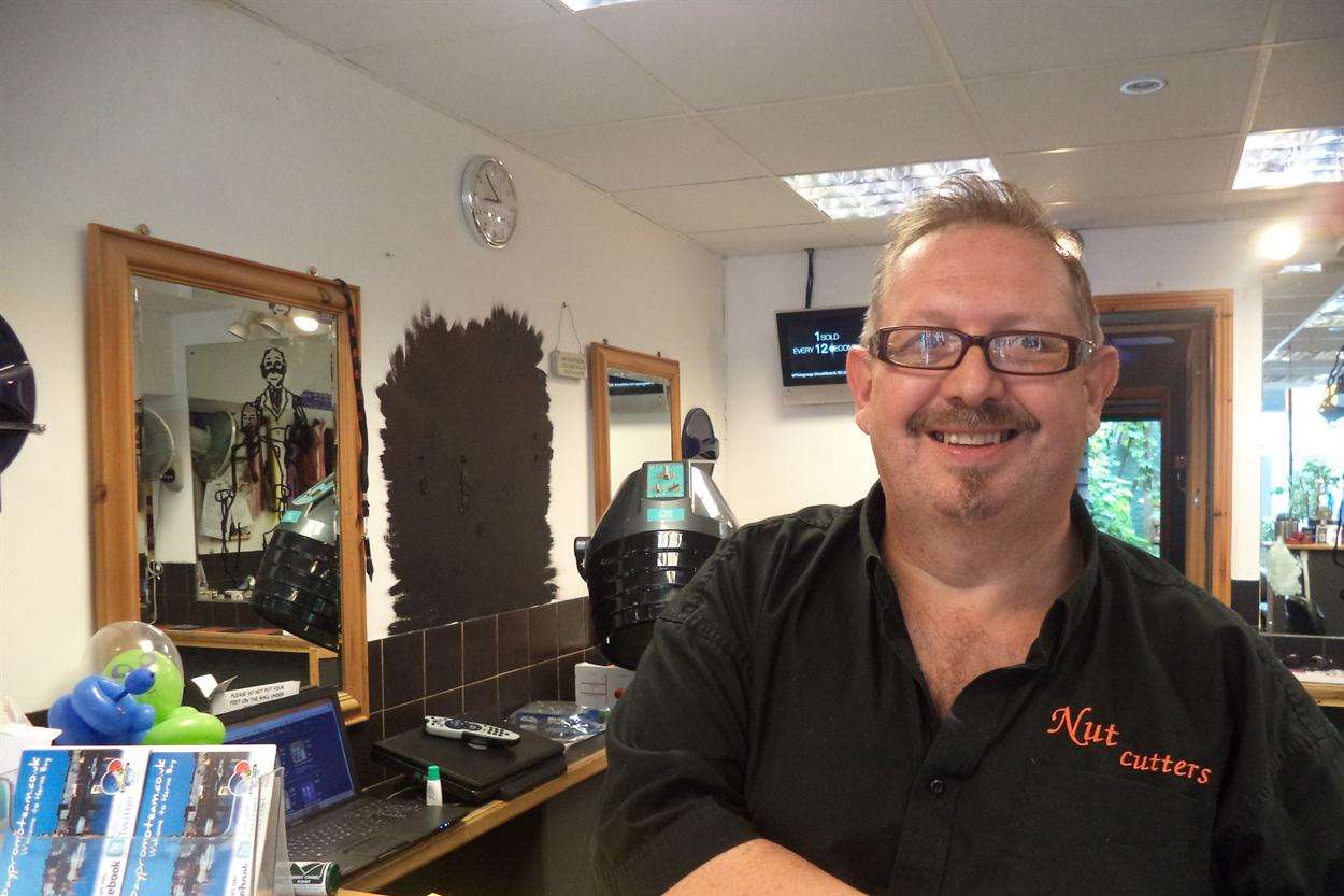 55-year-old Kevin Almond in his salon in Bank Street