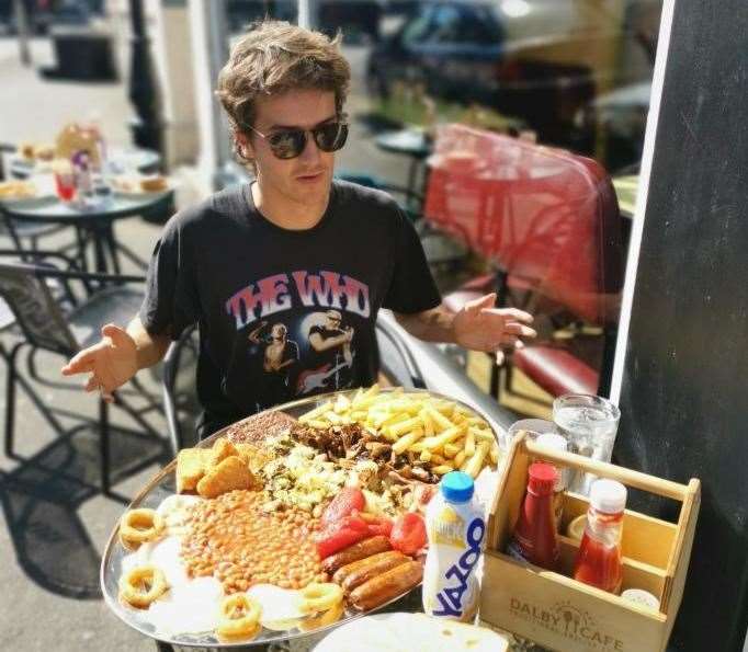 Mr Young tucking into the huge plate of food. Pic: Sports Team Twitter