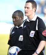 DEADMAN WALKING: The referee leaves the field at the final whistle. Picture: GRANT FALVEY