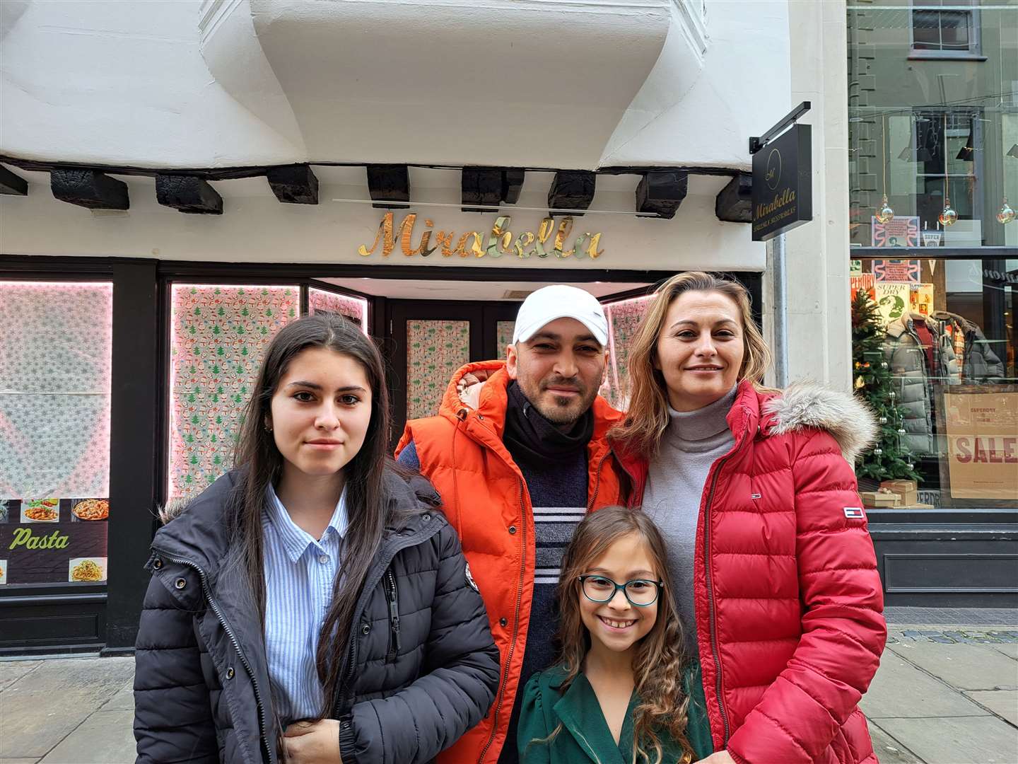 Stelian, 40, Marina, 38, Monalisa, 15 and Alessia, 8 outside Mirabella in St Margaret's Street, Canterbury