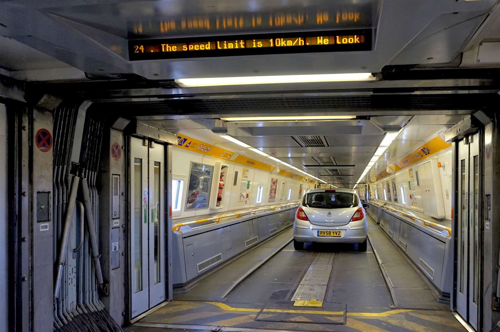 Folkestone, England - May 07 2016: Doors between carriages on the Euro Tunnel train Folkestone to France are open as the cars start to drive off. (8573429)