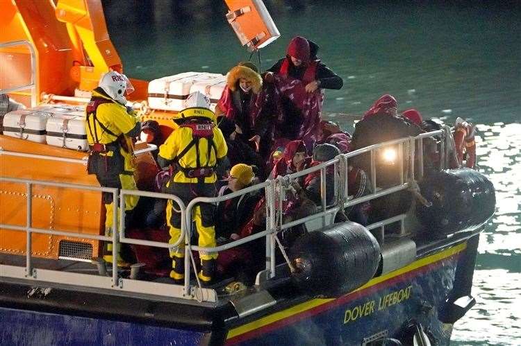 A group of people thought to be asylum seekers are brought in to Dover, Kent, by the RNLI. Picture: Gareth Fuller/PA