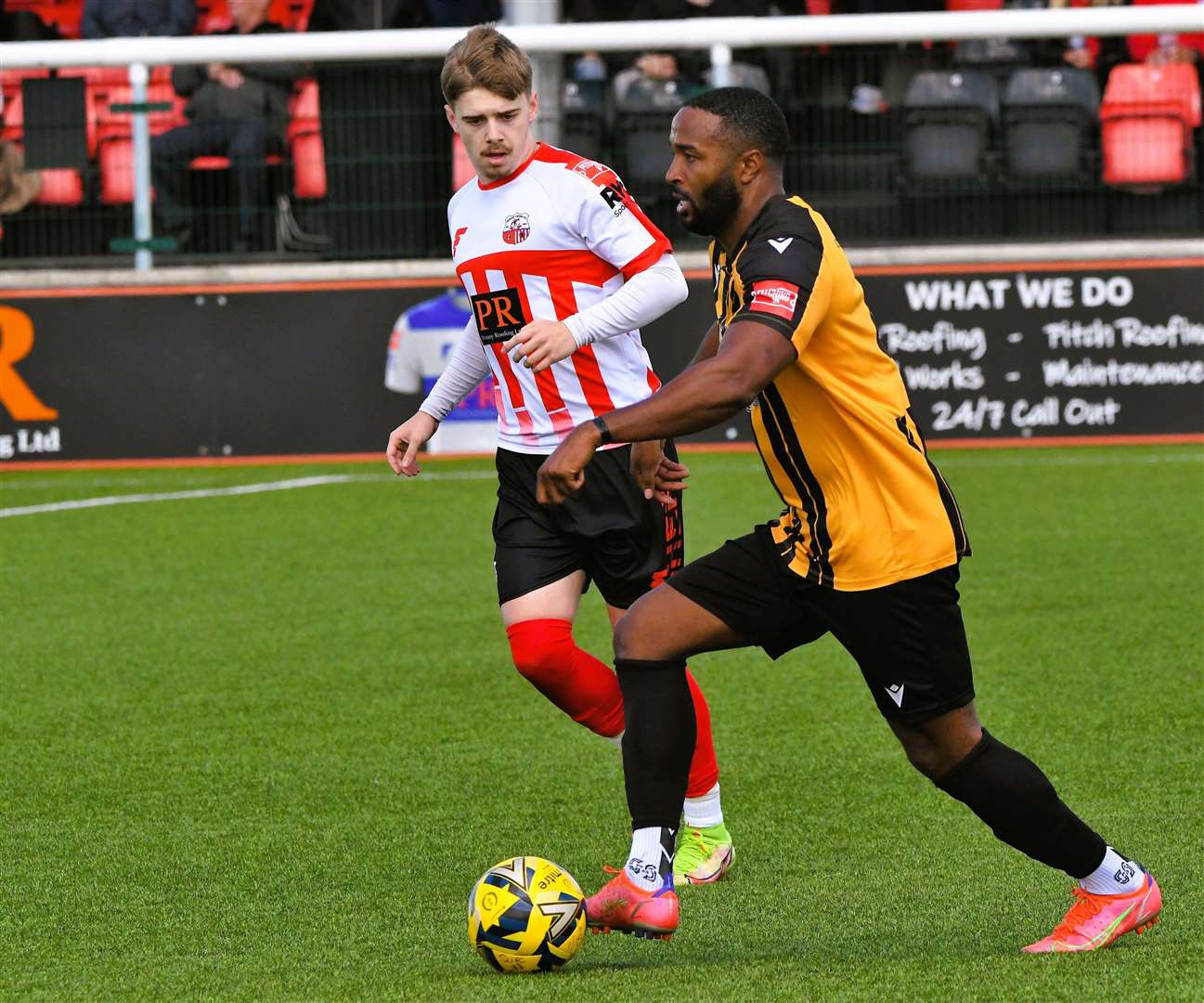 Defender Ian Gayle looks for a Folkestone Invicta team-mate against Sheppey. Picture: Marc Richards