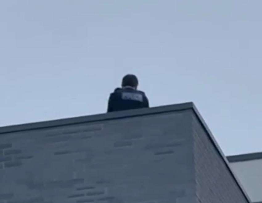 Police on the roof of a block of flats in Edgewater, St Mary's Island, Chatham. Picture: Ryan Loveday