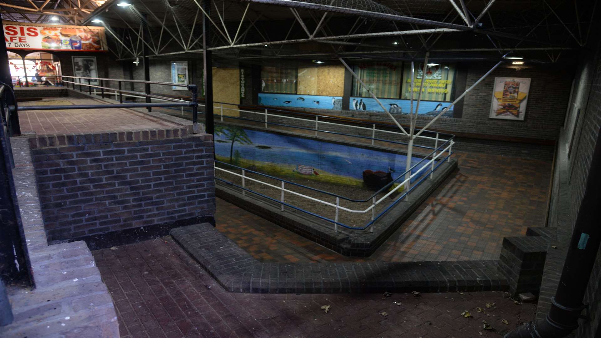 The inside of the mall is dirty and in a state of disrepair.