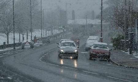 Motorists take care as snow falls on New Road, Chatham. Pictures: Peter Still