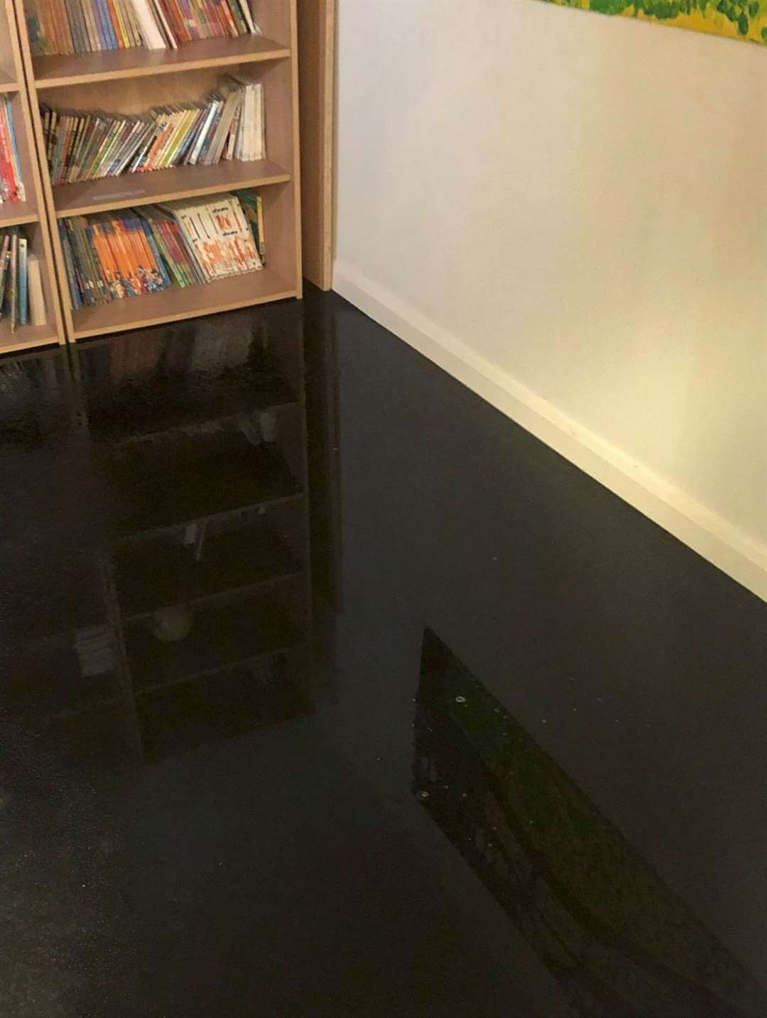 The flooding St Benedict's Catholic Primary School destroyed the library a year ago