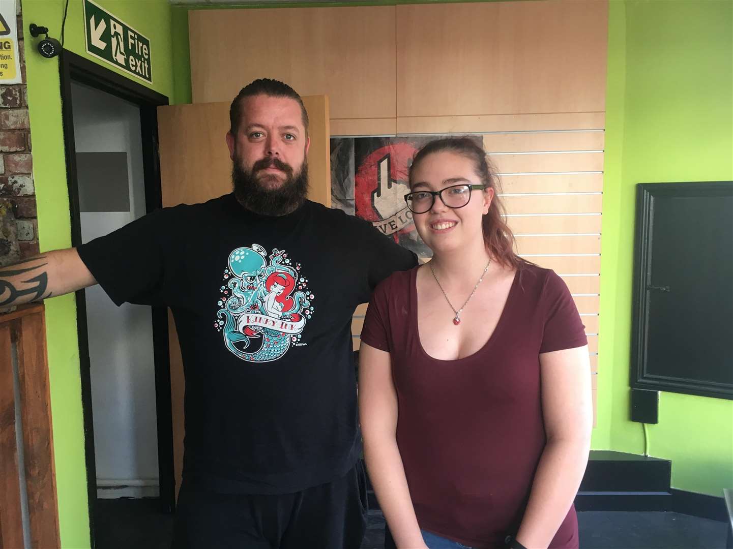 Matt Goldup, a tattooist at Tat 2 Ltd, with customer Grace Hollingsworth