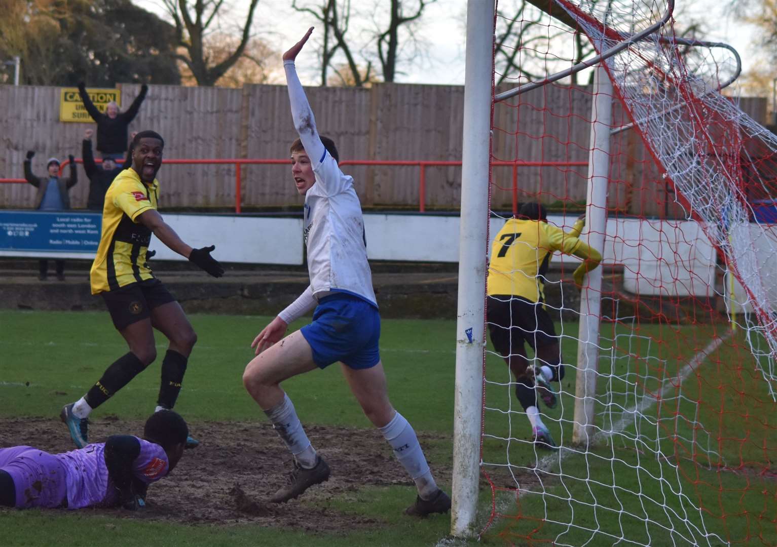 Gil Carvalho (No.7) wheels away after scoring Herne Bay's injury-time equaliser at Erith & Belvedere. Picture: Alan Coomes