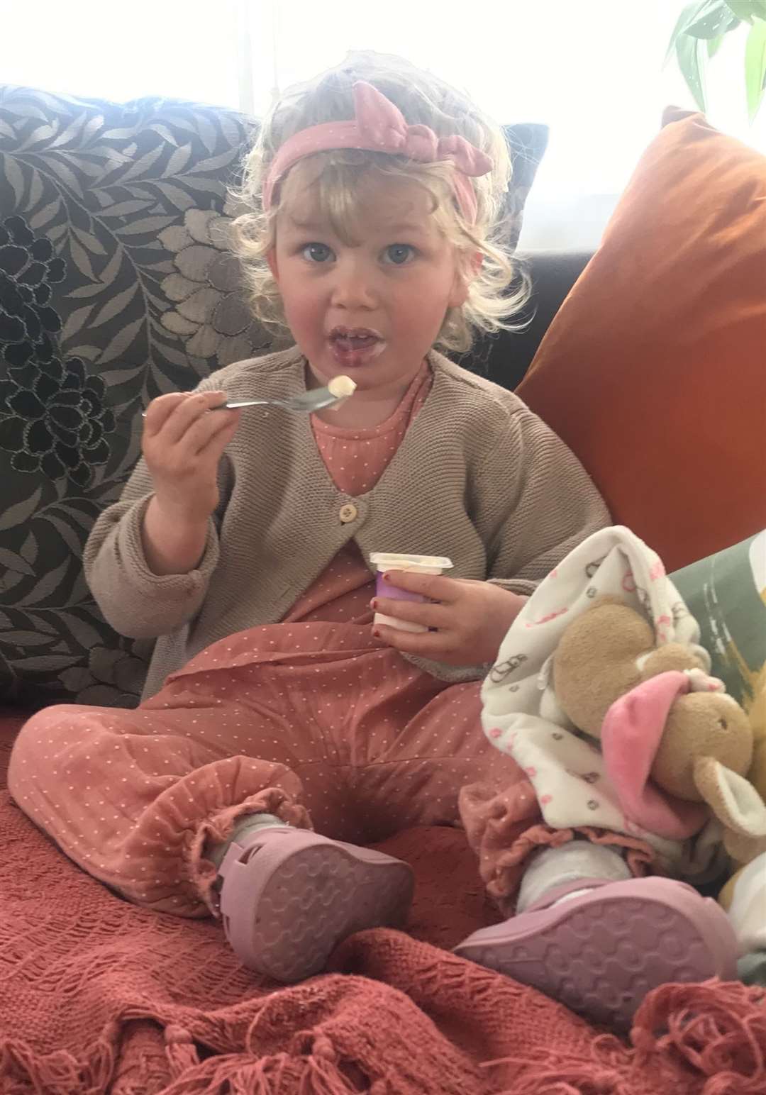 Granddaughter Bella Green, two, tucks in