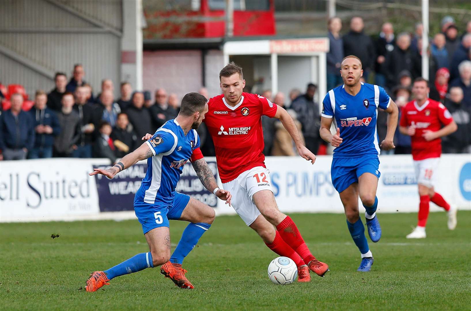 Michael Cheek runs at Liam Hogan Picture: Andy Jones