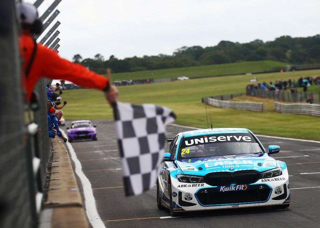 Platts Heath's Jake Hill takes the chequered flag at Snetterton. Picture: Jakob Ebrey/BMW