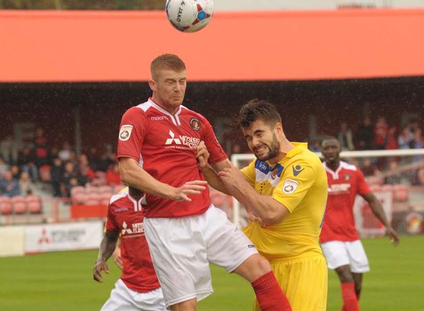 Alex Osborn gets up well to win this header Picture: Steve Crispe