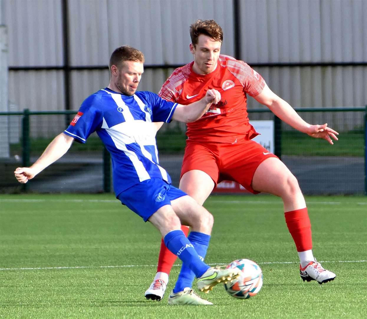 Josh Wisson, scorer of Hythe’s equaliser at Herne Bay, closes down Scott Heard. Picture: Randolph File