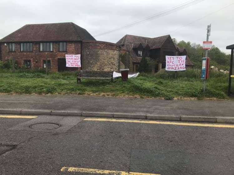 There are signs for and against a KFC in Snodland. Credit: Katie Rose