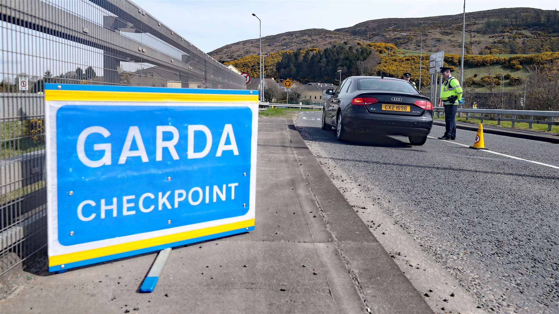 Gardai man a checkpoint on the border with Northern Ireland at Carrickarnon, Co Louth (Niall Carson/PA)