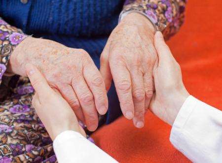 Elderly person being helped