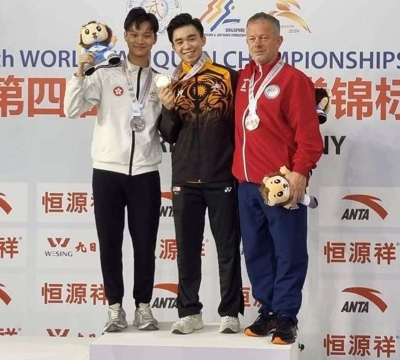 Canterbury's Barry Phelan (right) on the podium at the Taijiquan World Championships in Singapore