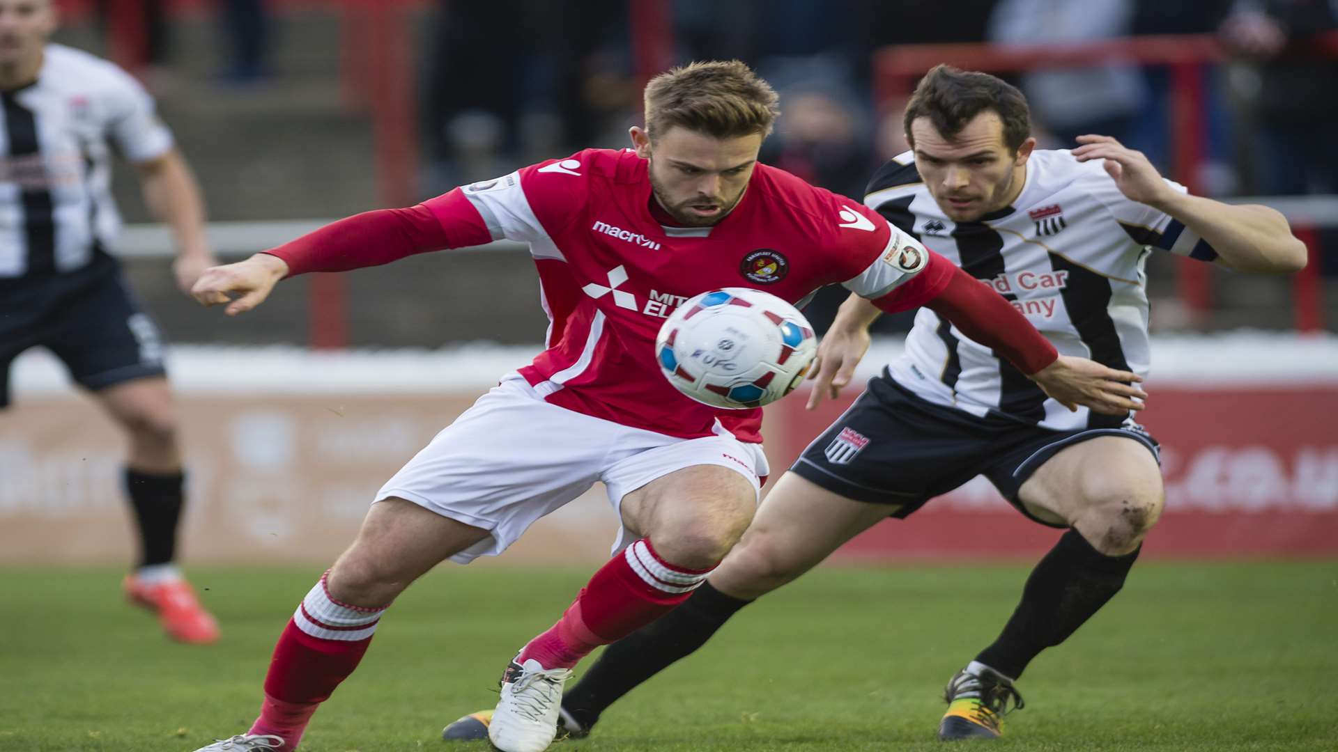 Matt Godden keeps his eye on the ball under pressure from Andy Gallinagh Picture: Andy Payton