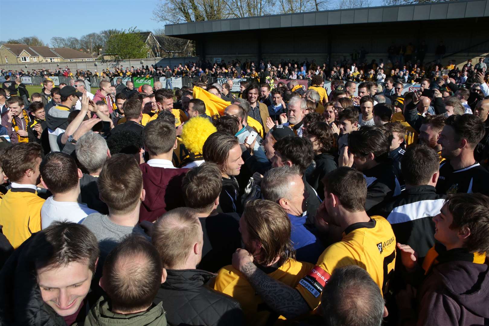 Fans celebrate on the pitch after a goalless draw at Dulwich Picture: Martin Apps