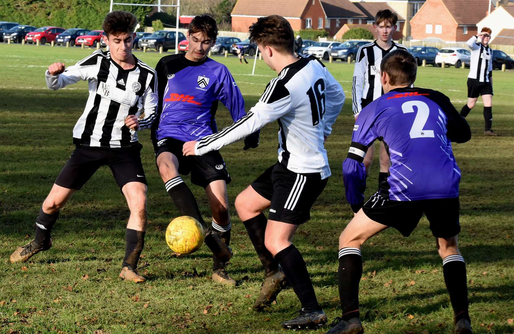 Real 60 Predators under-18s (stripes) compete for possession against Anchorians United under-18s. Picture: Ken Mears FM23729813