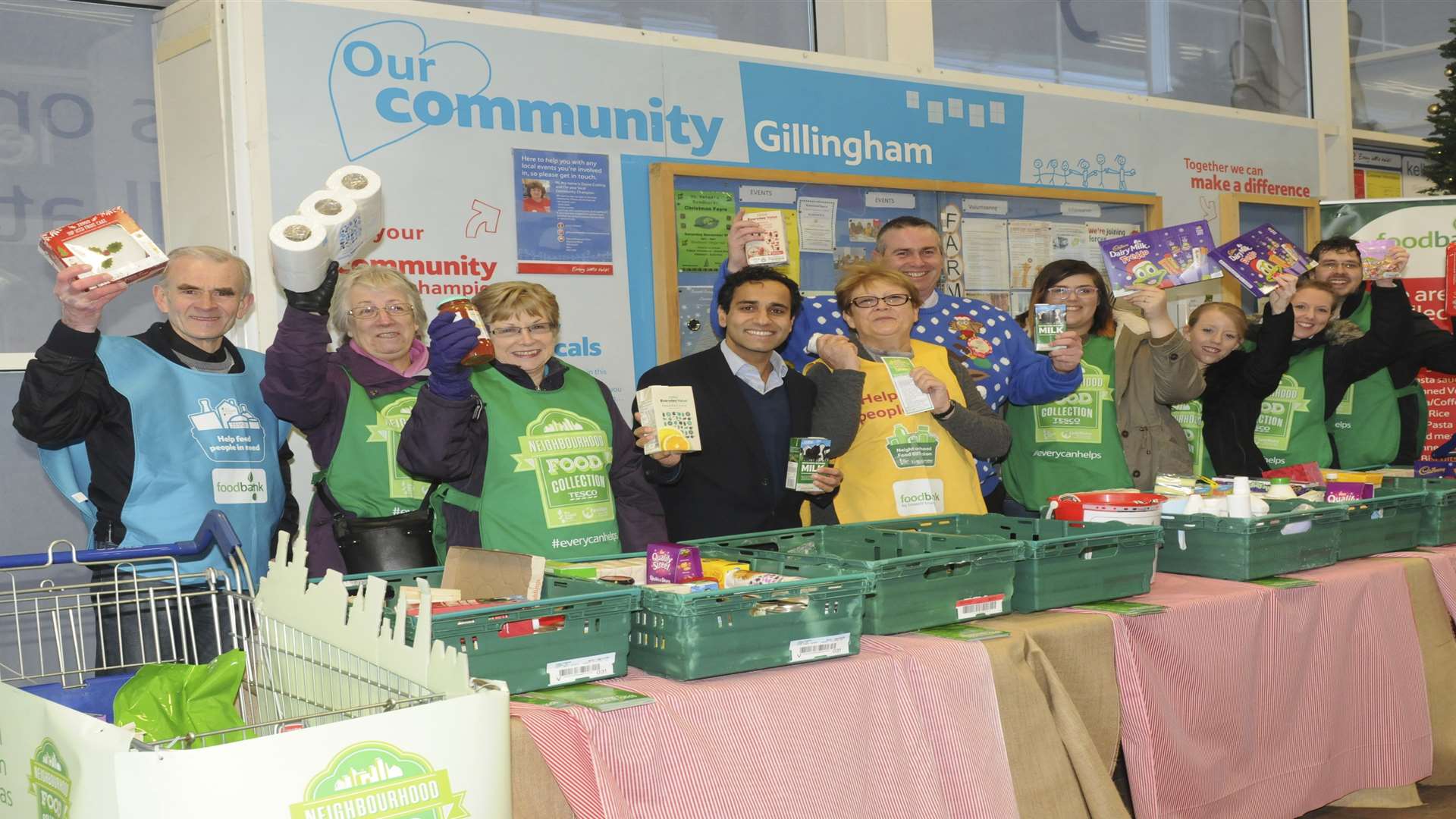 Foodbank staff with MP Rheman Chishti and Tesco Extra store manager Steve Peeling.