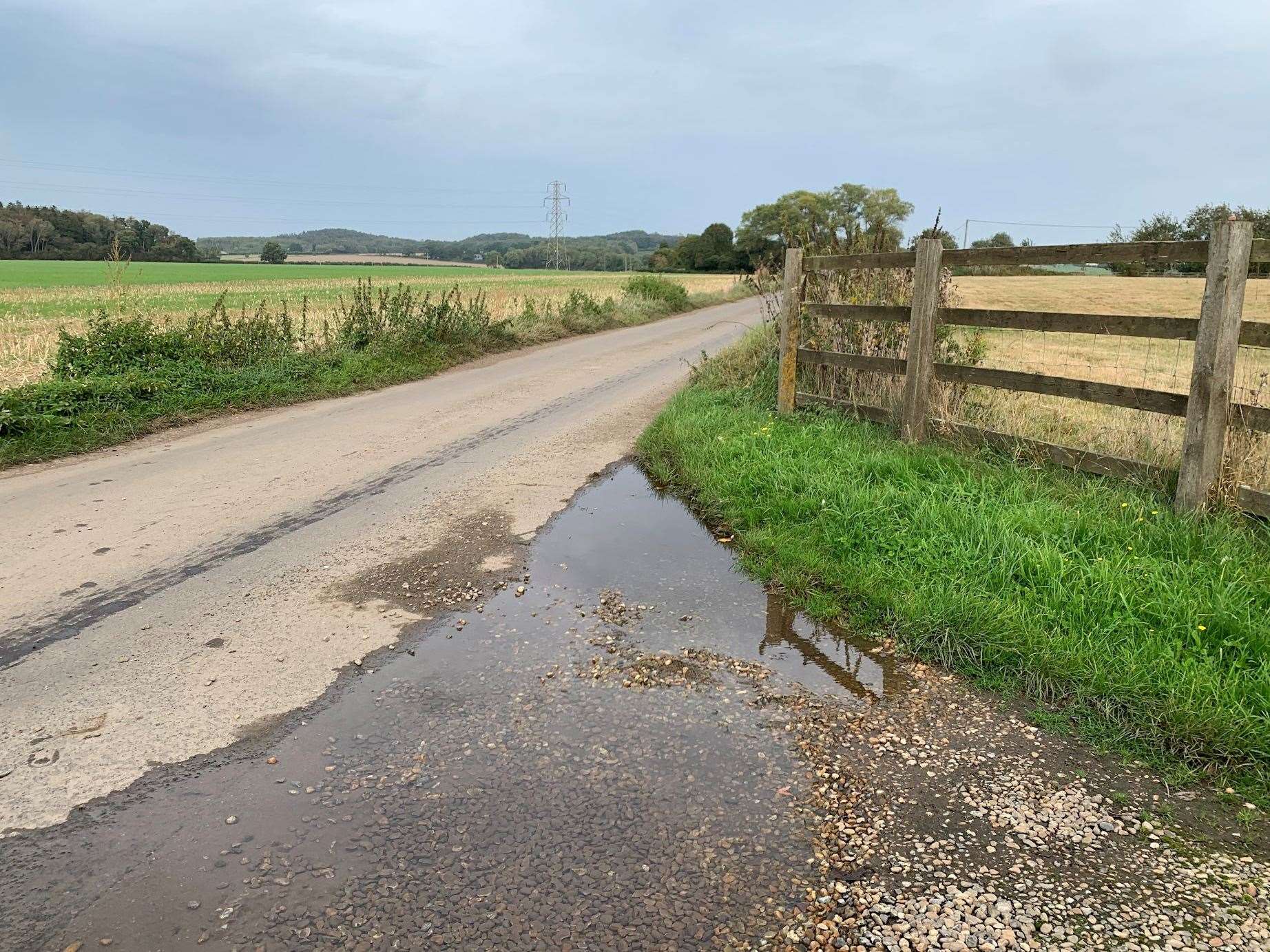 There are now deep puddles on the couple's drive as the water has washed away gravel