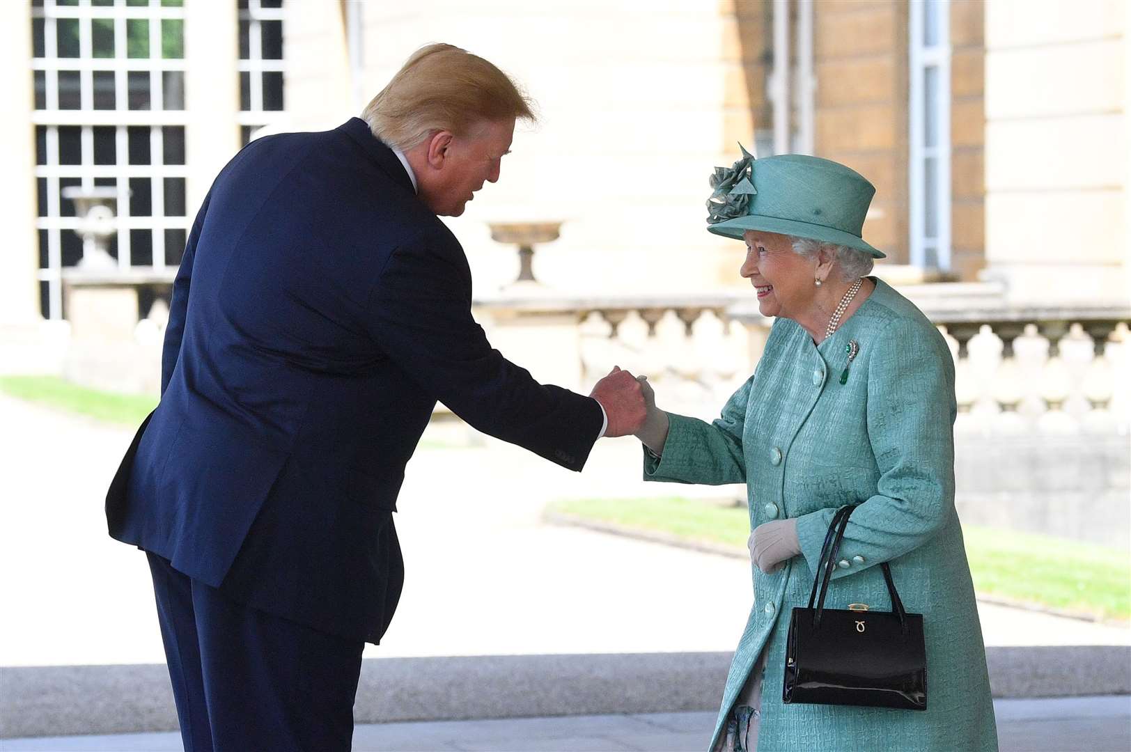 The late Queen Elizabeth II greets Donald Trump at Buckingham Palace (Victoria Jones/PA)