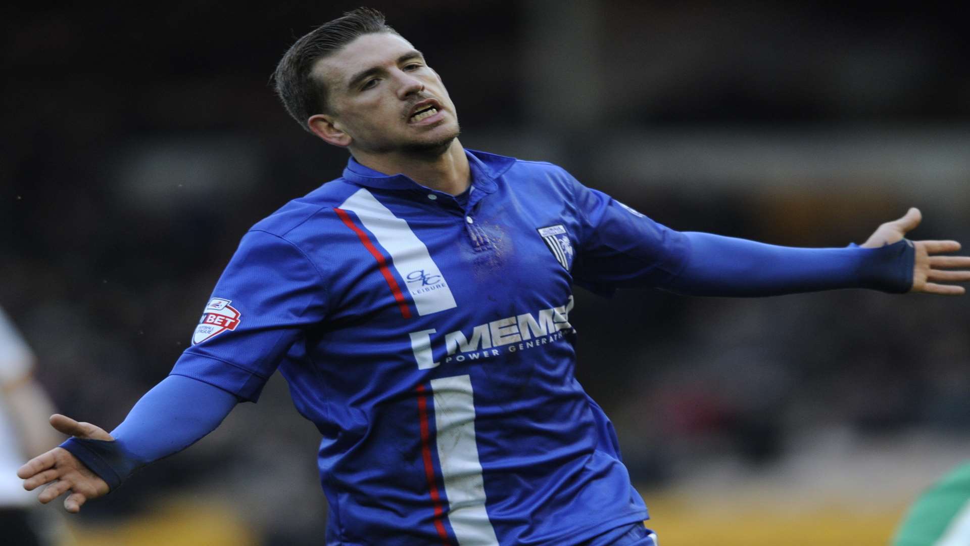 Cody McDonald celebrates scoring for Gillingham