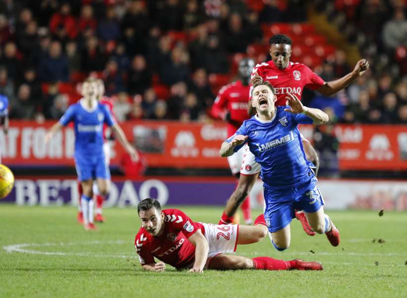 Harry Lennon gets a booking after this foul on Gills' Mark Byrne Picture: Andy Jones